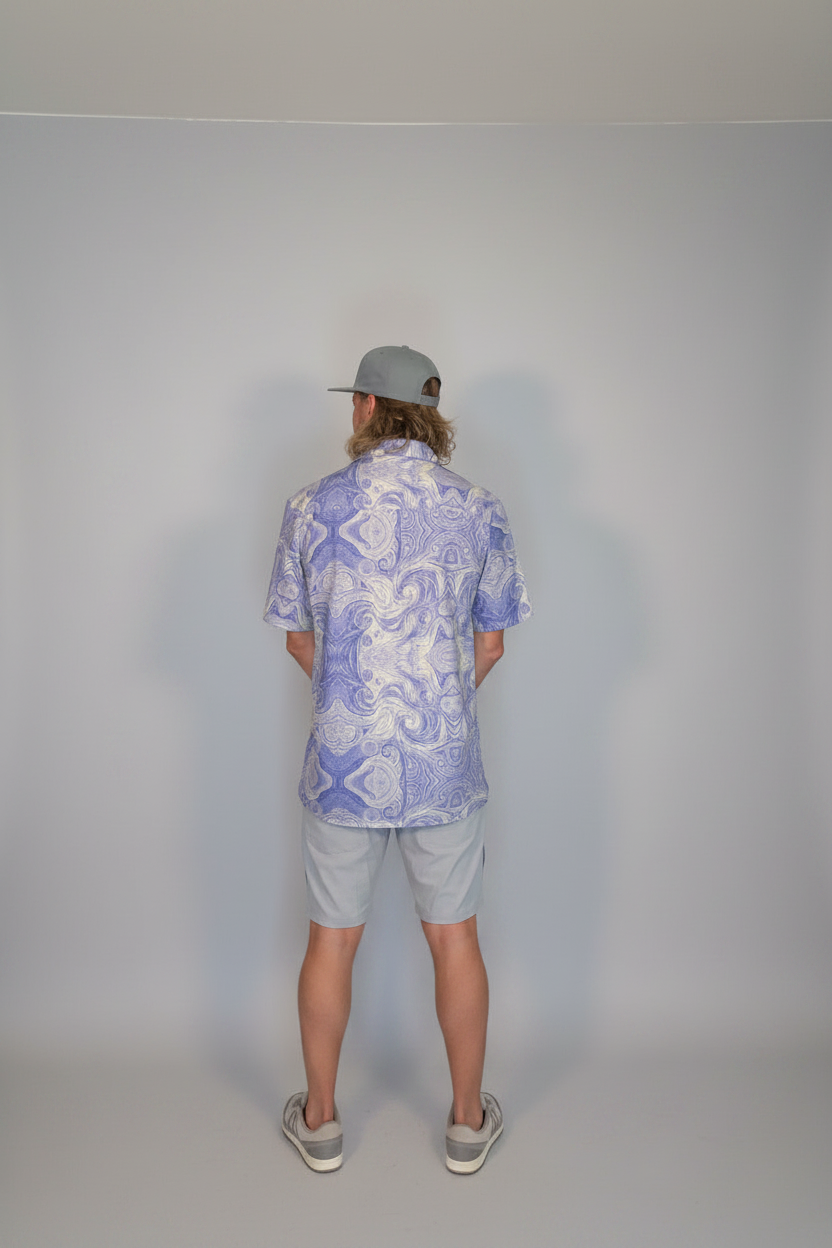Model wearing the Savvy Munk Trippy Night Lav - Unisex Button Shirt, highlighting the bold graphic print and relaxed festival-ready fit in a lifestyle setting.