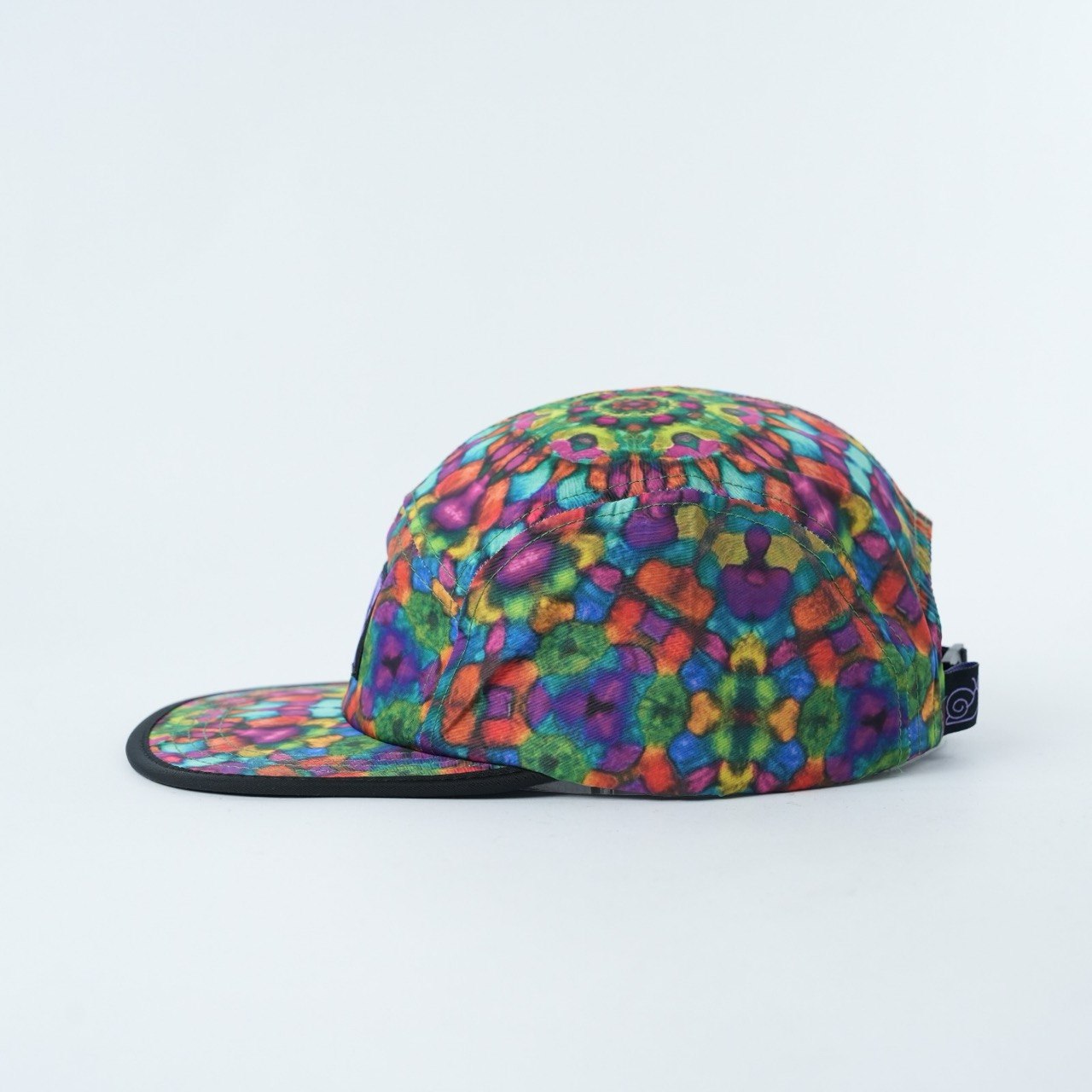 Savvy Munk Grass Water 5-Panel Hat displayed flat, highlighting the vibrant psychedelic print