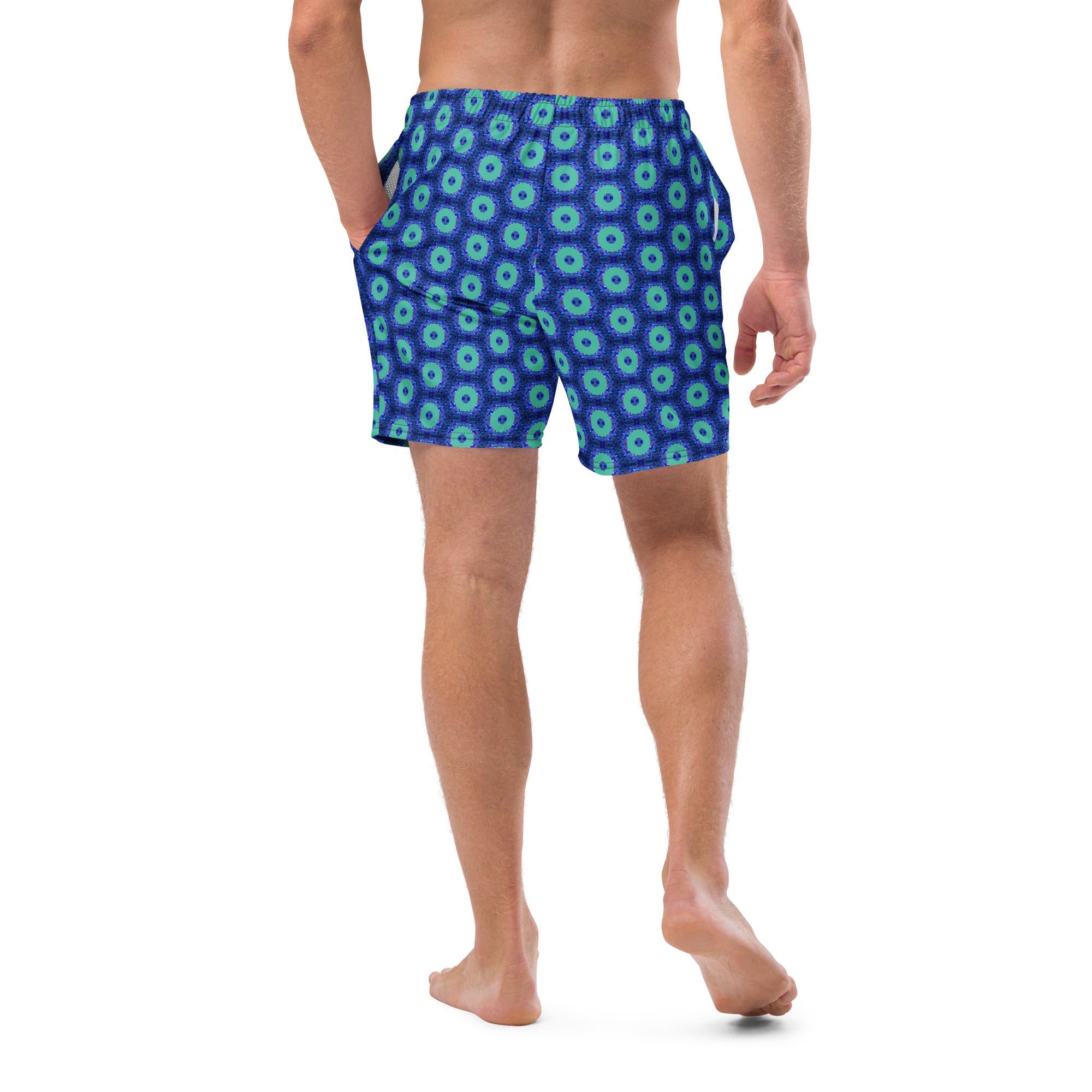Model wearing the Savvy Munk Donut Remix - Recycled Swim Trunks, highlighting the bold graphic print and relaxed festival-ready fit in a lifestyle setting.
