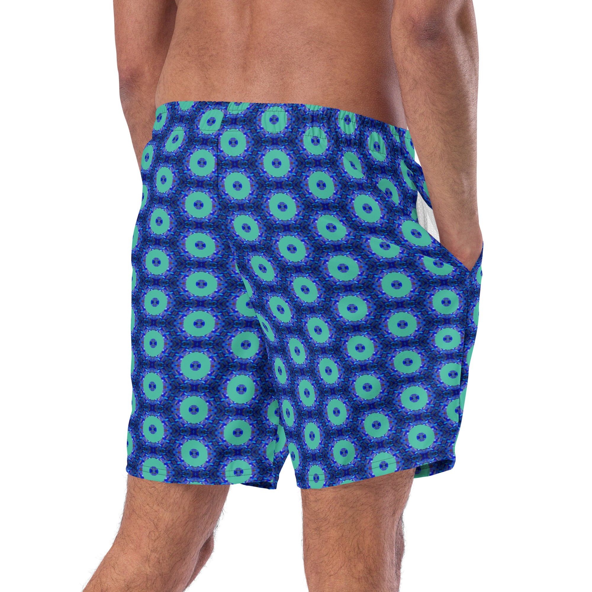 Model wearing the Savvy Munk Donut Remix - Recycled Swim Trunks, highlighting the bold graphic print and relaxed festival-ready fit in a lifestyle setting.