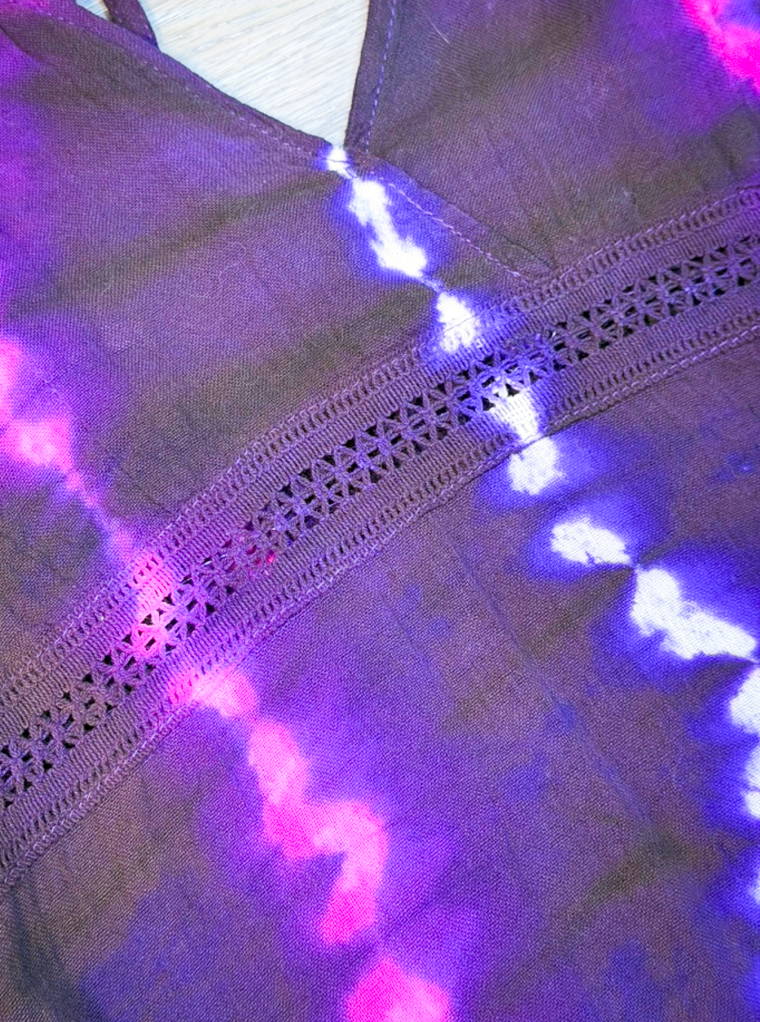 Savvy Munk Electric Orchid Tiered Maxi Dress featuring a black, blue, and hot pink tie-dye pattern on a tiered skirt and bodice with spaghetti straps close up 