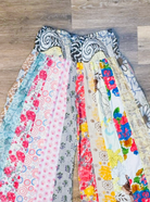 Savvy Munk Meadows of Nepal Palazzo Pants with colorful floral patchwork patterns, close-up view. 