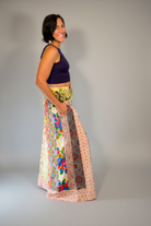 Savvy Munk Model April wearing Wildflower Wanderer Patchwork Palazzo Pants with a deep dark purple Crop top