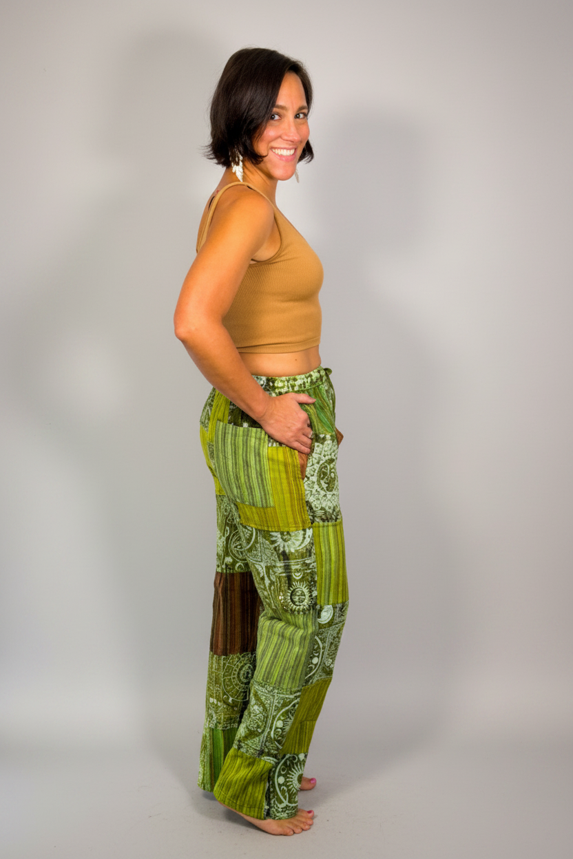 Savvy Munk model wearing Sage Sunburst Patchwork Drawstring Pants, side view, hand in pocket 