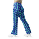 Model wearing the Savvy Munk Donut Remix - Flare Leggings, highlighting the bold graphic print and relaxed festival-ready fit in a lifestyle setting.