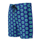 Model wearing the Savvy Munk Donut Remix - Men's Board Shorts, highlighting the bold graphic print and relaxed festival-ready fit in a lifestyle setting.