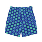 Model wearing the Savvy Munk Donut Remix - Recycled Swim Trunks, highlighting the bold graphic print and relaxed festival-ready fit in a lifestyle setting.