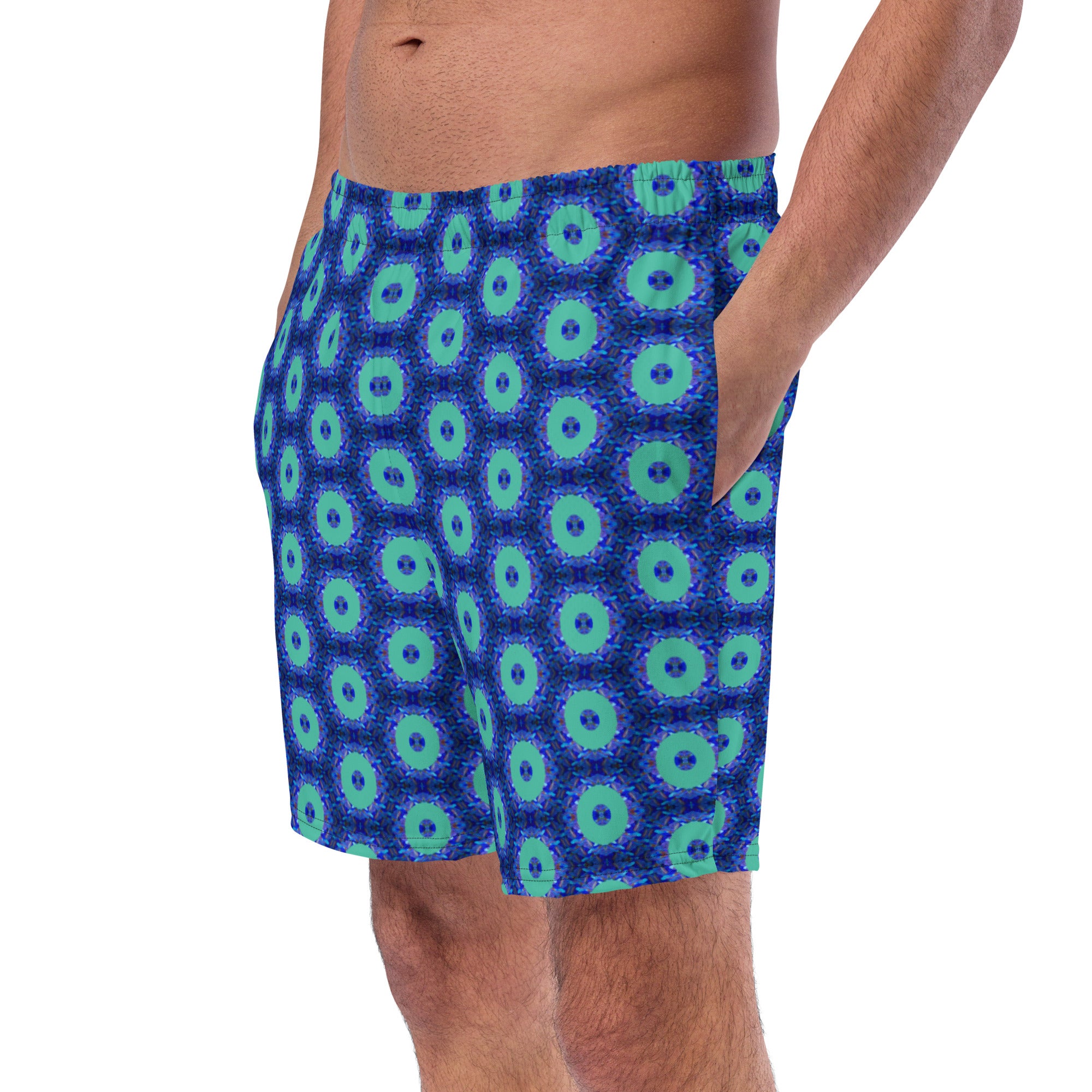 Model wearing the Savvy Munk Donut Remix - Recycled Swim Trunks, highlighting the bold graphic print and relaxed festival-ready fit in a lifestyle setting.