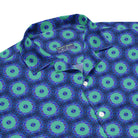 Model wearing the Savvy Munk Donut Remix - Button-Up Shirt, highlighting the bold graphic print and relaxed festival-ready fit in a lifestyle setting.